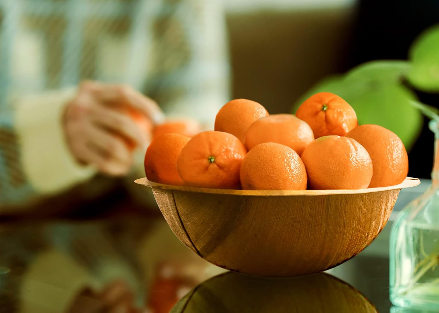 Fruits in a palm leaf bowl used as a fruit bowl on a table